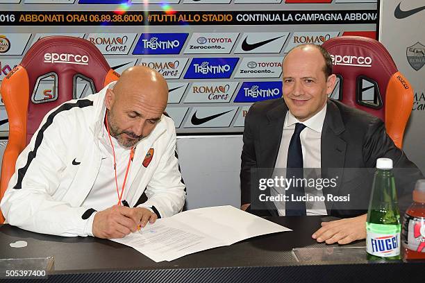 New coach of AS Roma Luciano Spalletti signs the contract after his first training session on January 14, 2016 in Rome, Italy.