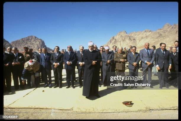 Religious figure leading ceremony w. Egyptian Pres. Anwar Sadat , US Trade Ambassador Robert Strauss & Gen. Kamal Hasan Ali w. Others in attendance