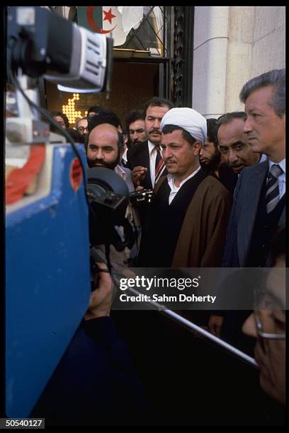 Iranian Parliamentary Pres. Hashemi Rafsanjanni leaving assembly hall during visit to country