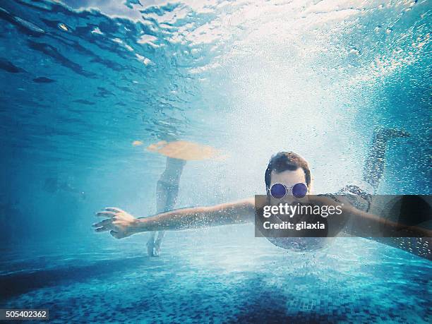 underwater fun. - man underwater stock pictures, royalty-free photos & images