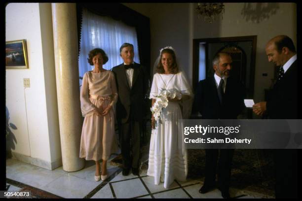 Lisa Halaby, bride of Jordan's King Hussein , standing with her parents Mr. And Mrs. Najeeb Halaby, on her wedding day.