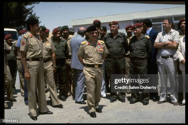 Jordan's King Hussein w. Other officials at welcoming ceremony for Palestinian soldiers upon their arrival at Mafrag Base after evacuation fr....