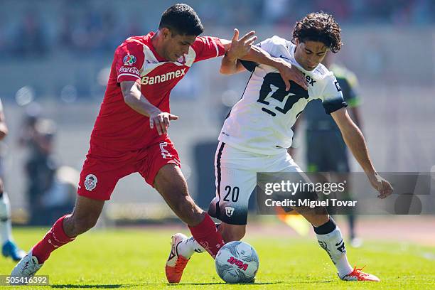 Matias Britos of Pumas fights for the ball with Francisco Gamboa of Toluca during a match between Pumas UNAM and Diablos Toluca as part of second...