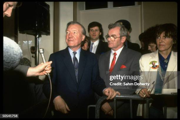 Fianna Fail Prime Minister Candidate Charles Haughey standing with supporters during election vote count.