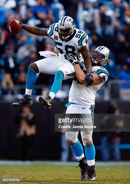 Thomas Davis and teammate Ryan Kalil of the Carolina Panthers celebrate an onside kick recovery against the Seattle Seahawks in the 4th quarter...