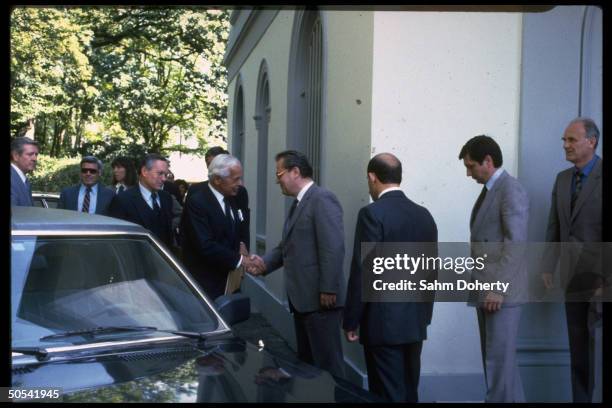 Negotiator Paul Nitze greeting his Soviet counterpart Yuli Kvitsinsky ouside the Russian mission, re arms talks.