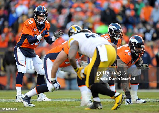 Peyton Manning of the Denver Broncos hikes the ball in the second quarter against the Pittsburgh Steelers during the AFC Divisional Playoff Game at...