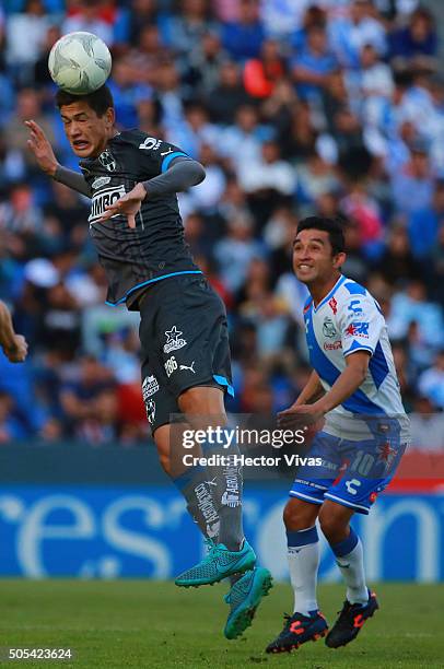 Cesar Montes of Monterrey struggles for the ball with Christian Bermudez of Puebla during the 2nd round match between Puebla and Monterrey as part of...