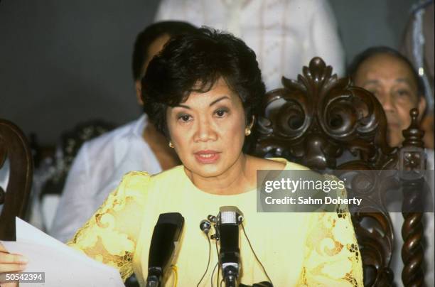 Philippine President Corazon Aquino announcing abolition of the constitution and parliament and institution of a revolutionary government at press...