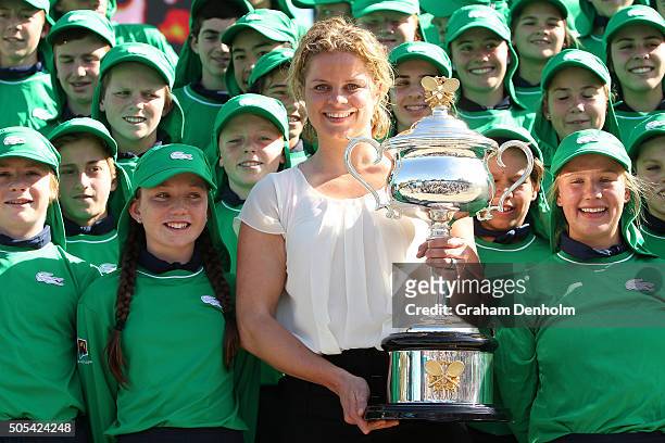 Former Australian Open Champion Kim Clijsters of Belgium poses with Daphne Akhurst Memorial Cup and 2016 ballkids during day one of the 2016...