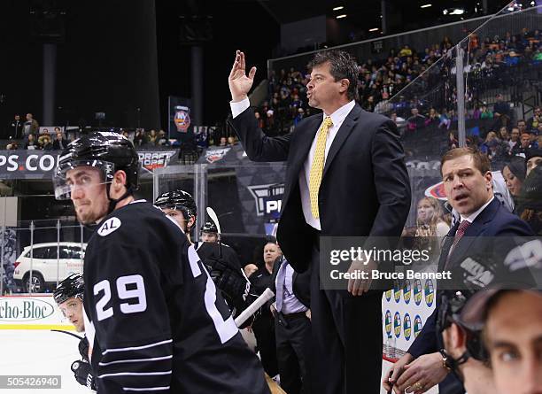 Jack Capuano of the New York Islanders signals the referee during the third period against the Vancouver Canucks at the Barclays Center on January...