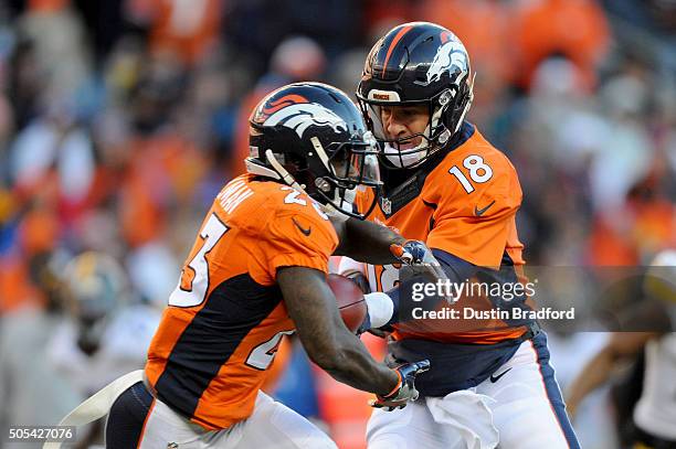 Peyton Manning of the Denver Broncos hands off to Ronnie Hillman of the Denver Broncos during the AFC Divisional Playoff Game against the Pittsburgh...