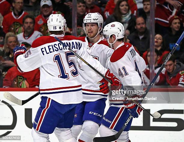 Tomas Fleischmann, Lars Eller and Paul Byron of the Montreal Canadiens celebrate Eller's first period goal against the Chicago Blackhawks at the...