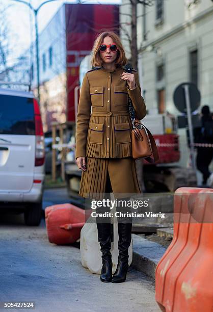 Candela Novembre wearing Marco de Vincenzo and Stuart Weitzman boots outside at No21 during Milan Men's Fashion Week Fall/Winter 2016/17 on January...