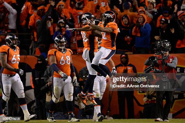 Andre Caldwell of the Denver Broncos and Demaryius Thomas of the Denver Broncos celebrate a 2-point conversion in the fourth quarter. The Denver...