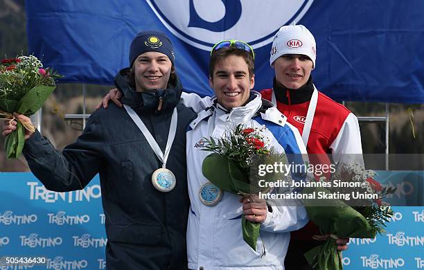 Francesco Tescari of Italy, Stanislav Palkin of Kazakhstan and Ignat Golovatsyuk of Belarus pose during the flower ceremony after winning the men...