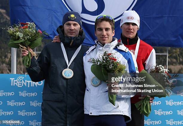 Francesco Tescari of Italy, Stanislav Palkin of Kazakhstan and Ignat Golovatsyuk of Belarus pose during the flower ceremony after winning the men...