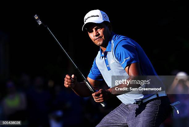 Fabian Gomez of Argentina celebrates after putting for birdie on the 18th green prior to a playoff against Brandt Snedeker during the final round of...