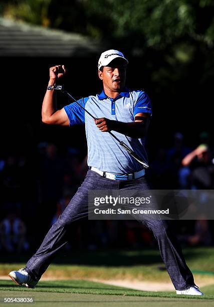 Fabian Gomez of Argentina celebrates after putting for birdie on the 18th green prior to a playoff against Brandt Snedeker during the final round of...