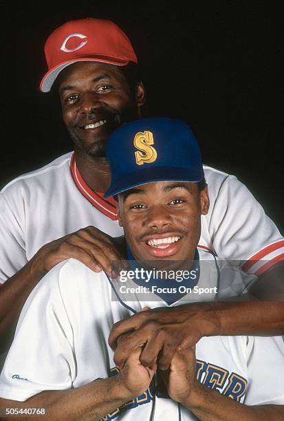 Outfielder Ken Griffey Jr of the Seattle Mariners poses for this portrait with his father Ken Griffey Sr of the Cincinnati Reds circa 1989. Griffey...