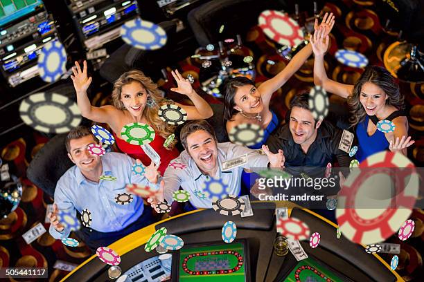 people winning at the casino - casino stock pictures, royalty-free photos & images