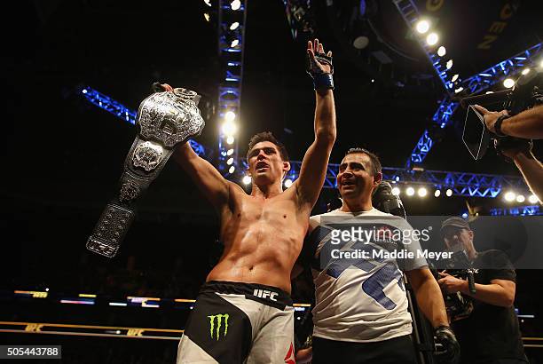 Dominick Cruz celebrates defeating T.J. Dillashaw to win the World Bantamweight Championship during UFC Fight Night 81 at TD Banknorth Garden on...