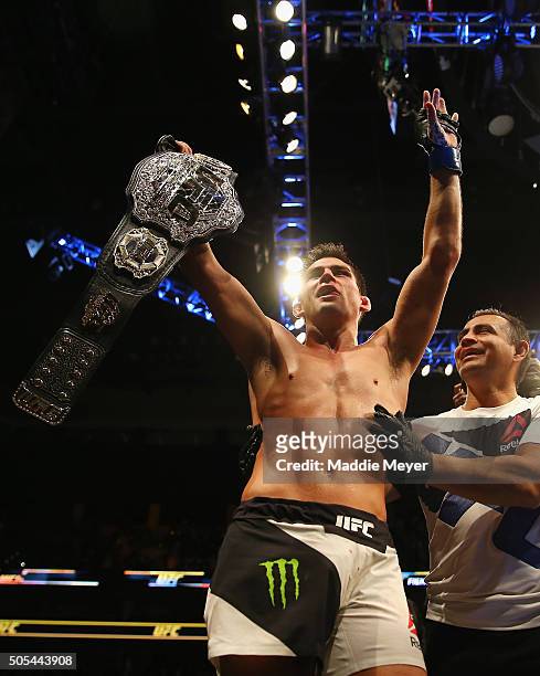 Dominick Cruz celebrates defeating T.J. Dillashaw to win the World Bantamweight Championship during UFC Fight Night 81 at TD Banknorth Garden on...