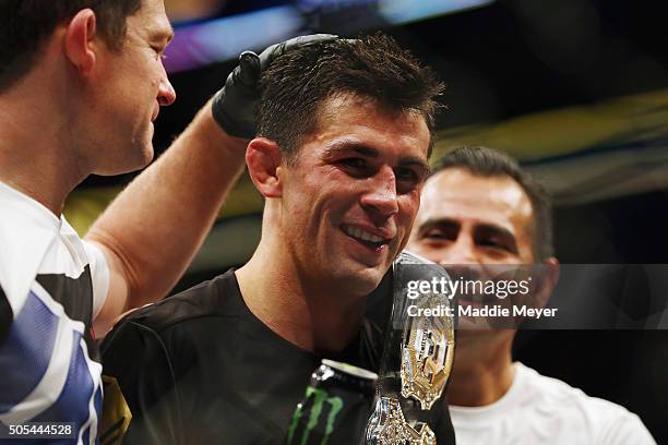 Dominick Cruz celebrates defeating T.J. Dillashaw to win the World Bantamweight Championship during UFC Fight Night 81 at TD Banknorth Garden on...