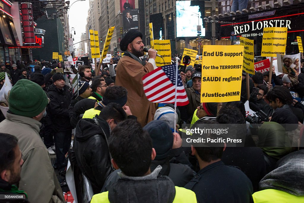 Zaheer Naqvi (center), a visiting imam from California,...