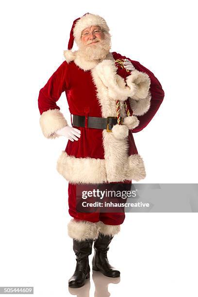 santa claus carrying his gift bag - santa sack isolated stock pictures, royalty-free photos & images