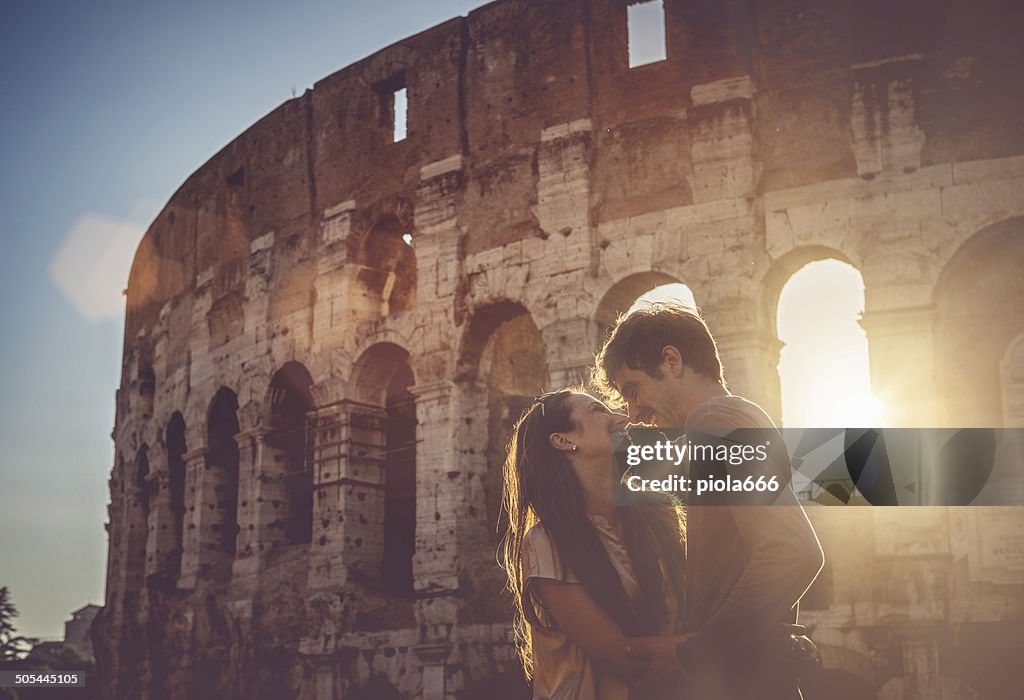 Passionate kiss in front of the Coliseum
