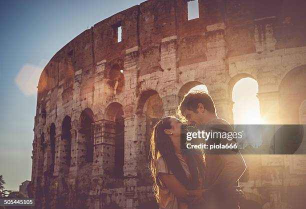 passionate kiss in front of the coliseum - rome stock pictures, royalty-free photos & images