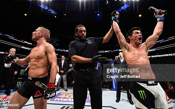 Dominick Cruz celebrates his split-decision victory over TJ Dillashaw in their UFC bantamweight championship bout during the UFC Fight Night event...