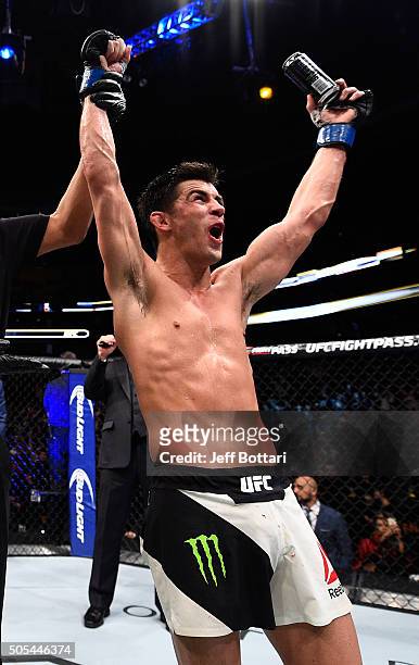 Dominick Cruz celebrates his split-decision victory over TJ Dillashaw in their UFC bantamweight championship bout during the UFC Fight Night event...