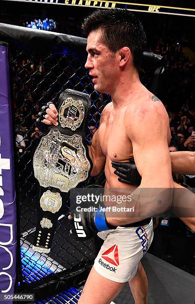 Dominick Cruz celebrates his split-decision victory over TJ Dillashaw in their UFC bantamweight championship bout during the UFC Fight Night event...