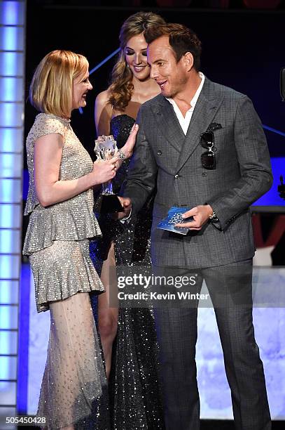 Actress Kirsten Dunst accepts the award for Best Actress in a Movie Made for Television or Limited Series for 'Fargo' from actor Will Arnett onstage...