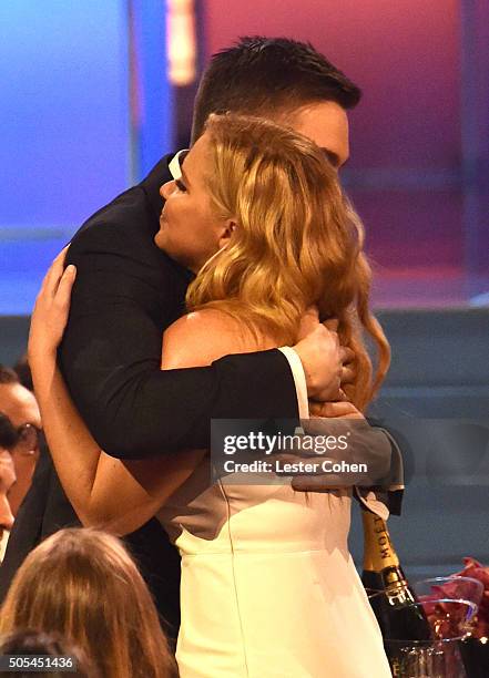 Actress Amy Schumer and Ben Hanisch during the 21st Annual Critics' Choice Awards at Barker Hangar on January 17, 2016 in Santa Monica, California.