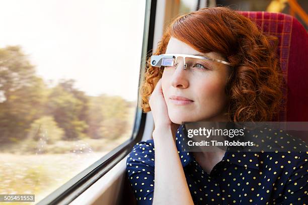 woman using smart-glass on train. - train front view stock pictures, royalty-free photos & images