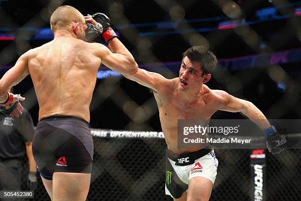 Dominick Cruz punches T.J. Dillashaw in their bantamweight bout during UFC Fight Night 81 at TD Banknorth Garden on January 17, 2016 in Boston,...