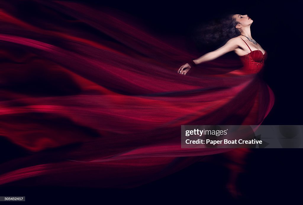 Woman in a long red flowing dress
