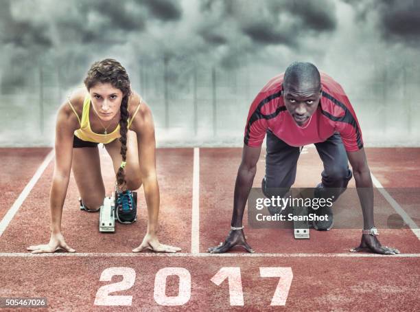 athletes in the starting blocks - track starting block stock pictures, royalty-free photos & images