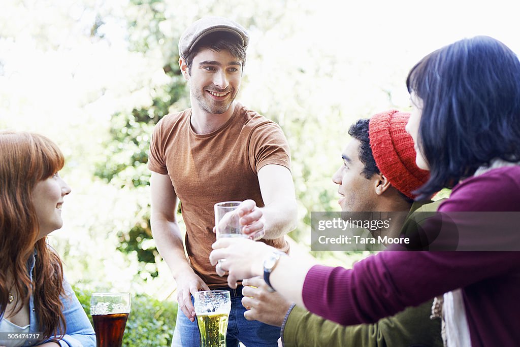 Four friends drinking in beer garden