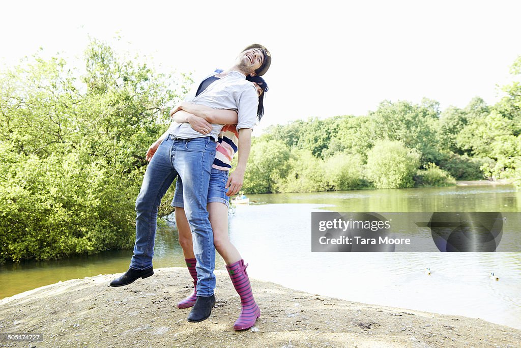 Woman lifting man in air