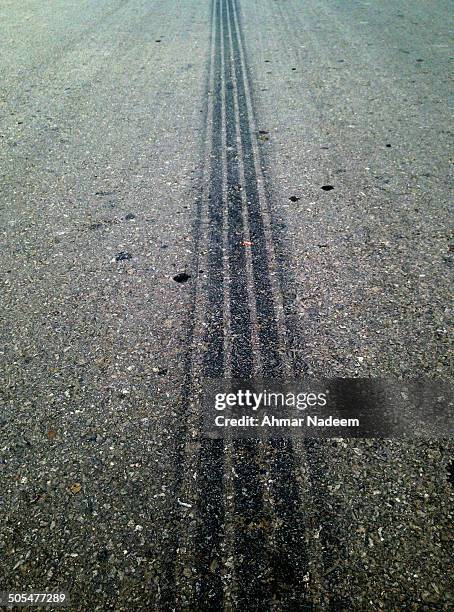 tire skid marks - tire track marks stock pictures, royalty-free photos & images