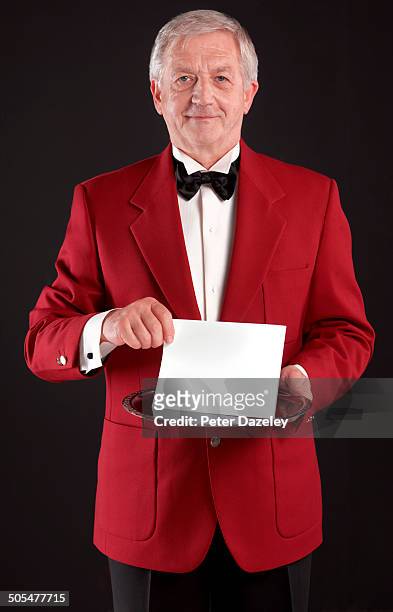 concierge with invitation on silver platter - retirement invitation stock pictures, royalty-free photos & images