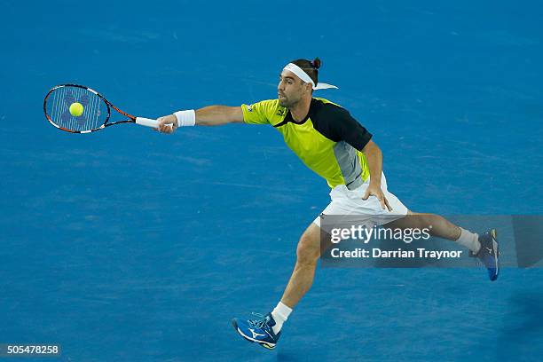 Marcos Baghdatis of Cyprus plays a forehand in his first round match against Jo-Wilfried Tsonga of France during day one of the 2016 Australian Open...