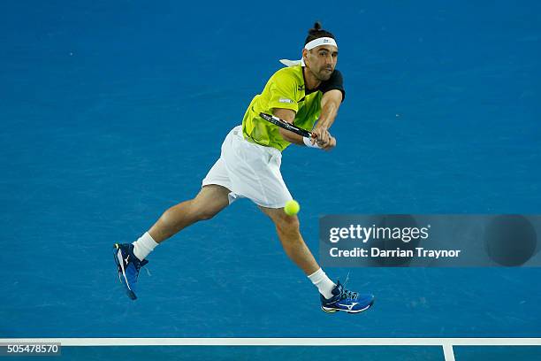 Marcos Baghdatis of Cyprus plays a backhand in his first round match against Jo-Wilfried Tsonga of France during day one of the 2016 Australian Open...