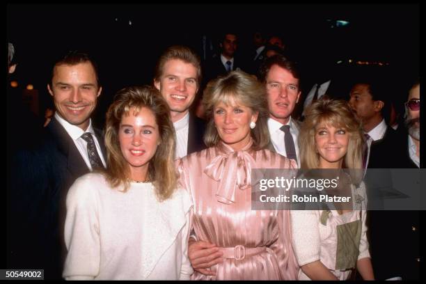 Cast members of TV show Dynasty including Michael Nader, Pamela Bellwood, Jack Coleman, Linda Evans, Gordon Thompson, and Heather Locklear.