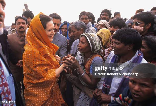 Congress Party leader Sonia Gandhi , Italian-born widow of assassinated former PM Rajiv Gandhi, working crowd at election campaign rally.