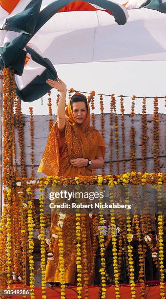 Congress Party leader Sonia Gandhi, Italian-born widow of assassinated former PM Rajiv Gandhi, waving to supporters during party election campaign...